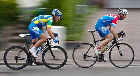 cyclists accelerating by standing on the pedals