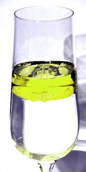 oil floating on water, due to its lower density