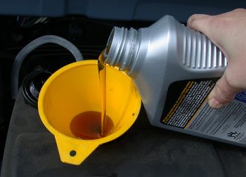 pouring engine oil pouring engine oil