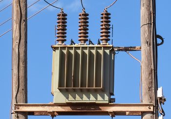 a high voltage power transformer on a post a high voltage power transformer on a post