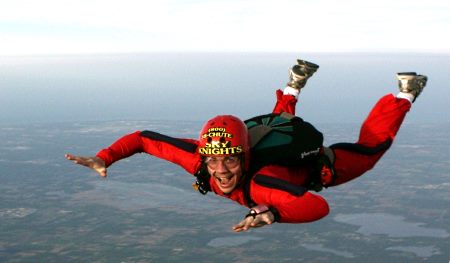 a woman in the free fall stage of skydiving