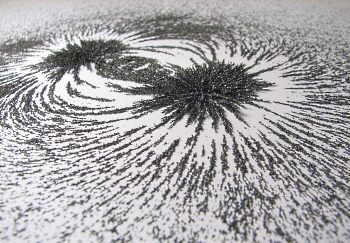iron filings showing magnetic field produced by a magnet
